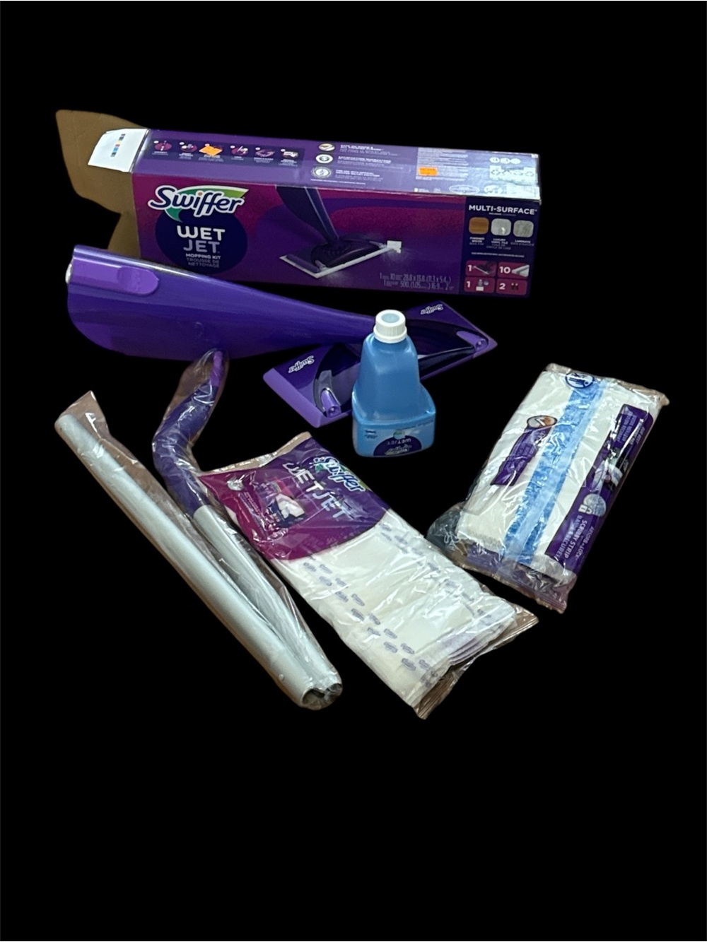 Swiffer WetJet mop in purple and silver with blue pad